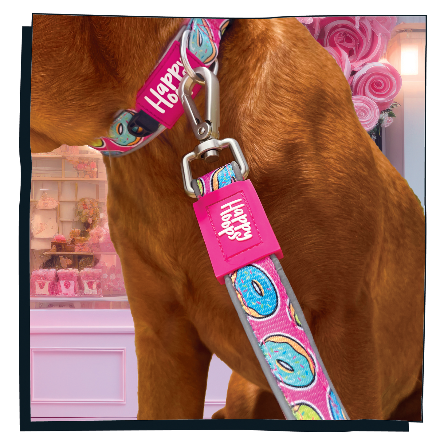 Close up of pink Happy Hoops dog lead with funky donut print design with plush pink neoprene padding, reflective strips, robust 360 degree metal rotating clasp and rust proof stainless steel D-ring.