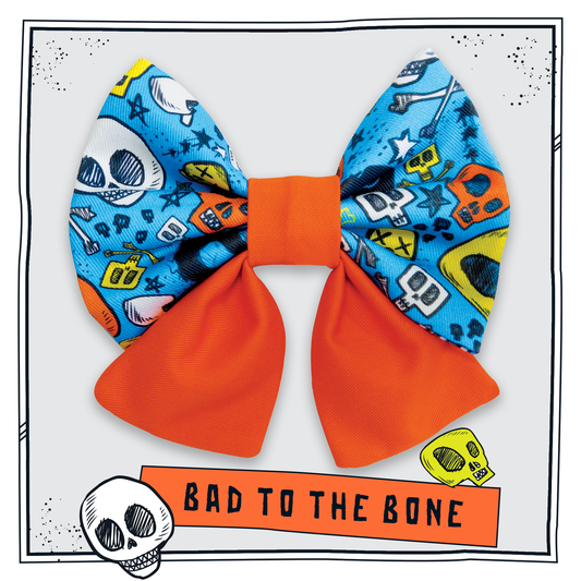 Happy Hoops orange bow tie with blue skull and bones pattern