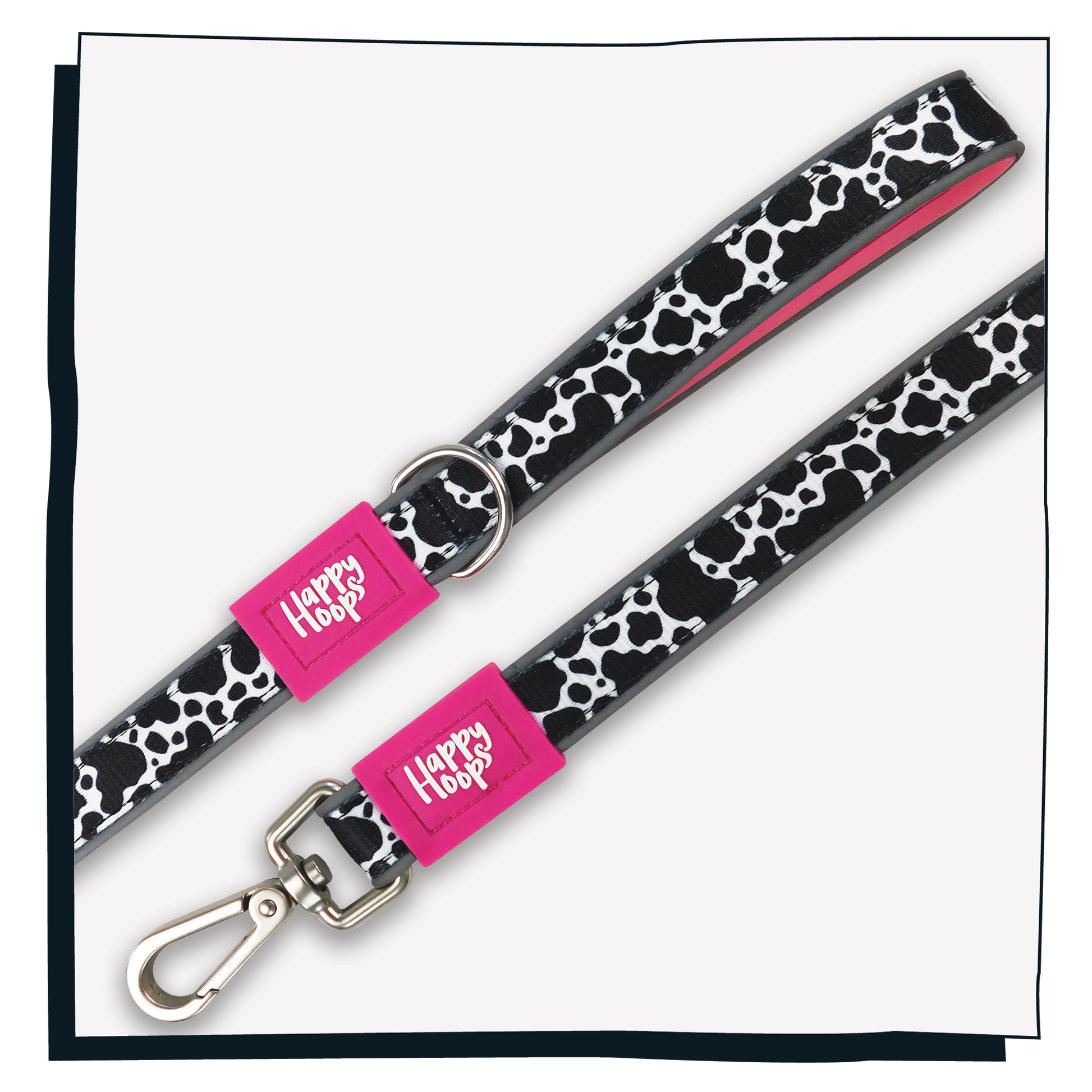 Aerial view of pink Happy Hoops dog lead with funky cow print design with plush pink neoprene padding, reflective strips, robust 360 degree metal rotating clasp and rust proof stainless steel D-ring.